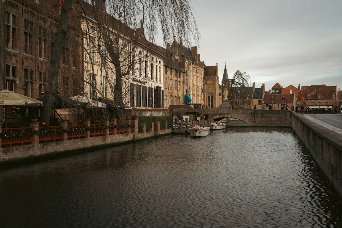Canal boats and historic buildings in Bruges, Belgium