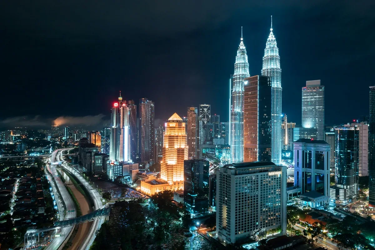 Kuala Lumpur skyline with the Petronas Twin Towers illuminated at night, Malaysia