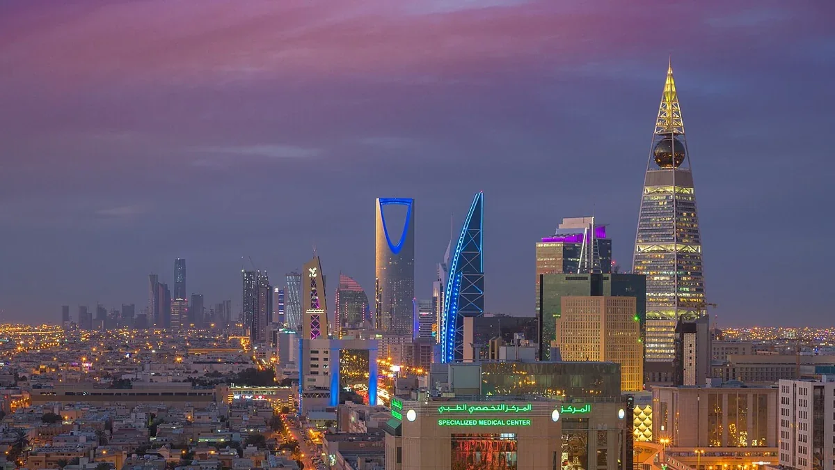 The Riyadh skyline with illuminated landmark towers at dusk, Saudi Arabia