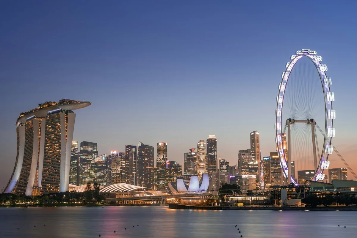 Marina Bay Sands and the Singapore Flyer across Marina Bay at dusk